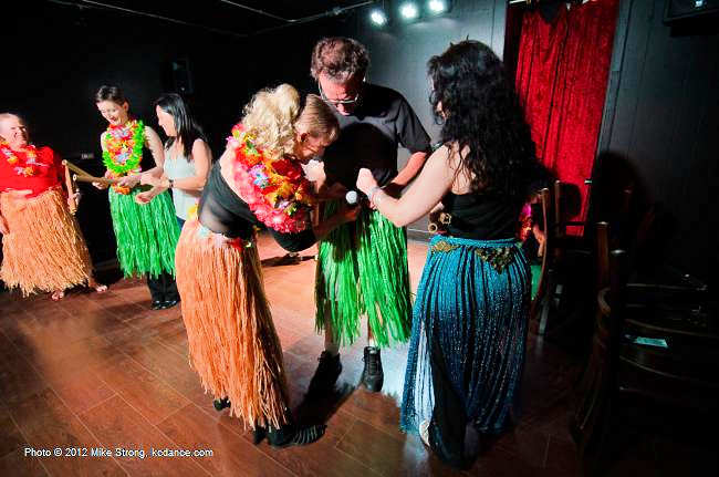 Fitting Gary with a grass skirt for a hula number - Nikoria