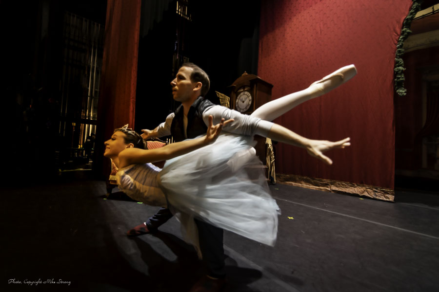 Pre-show, behind the curtain, Julia Walewicz and Ben Rabe practicing a fish position for Snow Queen and King