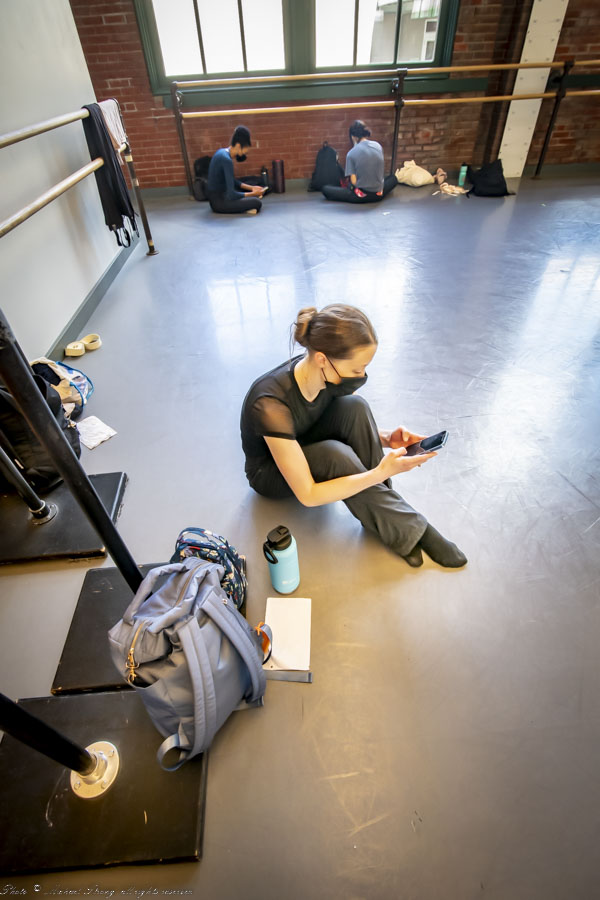 Break during early rehearsal at Bolender Center, going from prop letters to electronic texts and email. Front is Taryn Mejia, behind Whitney Huell and Naomi Tanioka. The rehearsals had as many as 14 dancers (backups, just in case) with eight dancers performing.