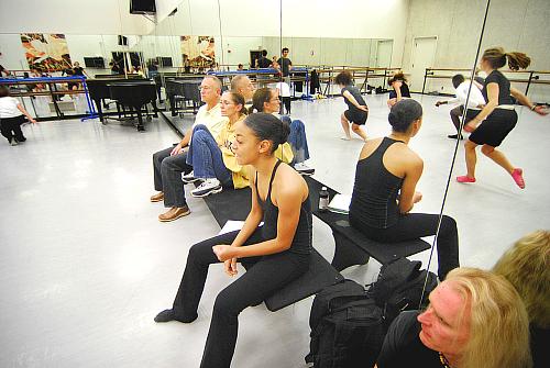 Chloe Abel (center) on the near end of the bench directing her arrangement of Twyla Tharp's piece. On the bench from far to near: William Whitener artistic director of Kansas City Ballet (KCB), Paula Weber Dance Division chair, and lighting guy E.J. Reinagel.