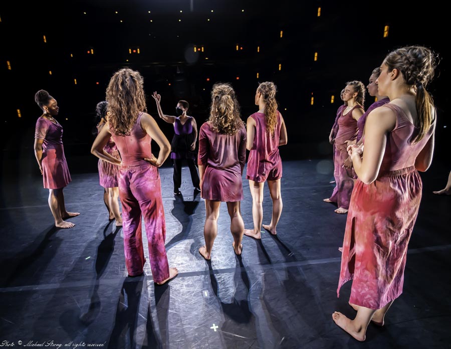 Carolyn Dorfman - notes in dress onstage with her dancers for Womb Wit and Wisdom - Storling Dance Theater.