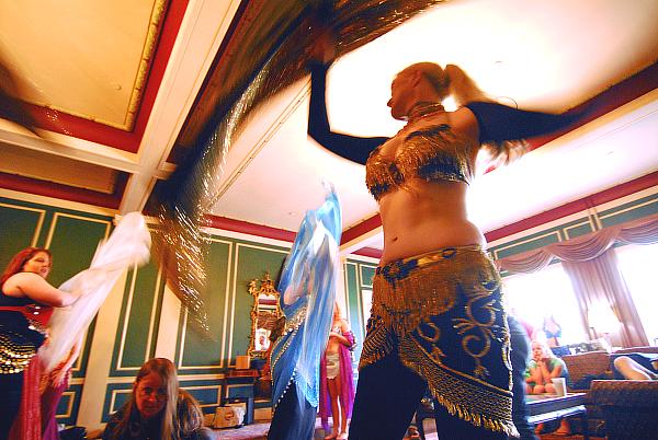 Four dancers swirl their veils over DP (Director of Photography) Deb Weems who is on the floor (left,center) shooting upward performing bellydance for the short film (video) - Is It Jazz? by Fred Weems