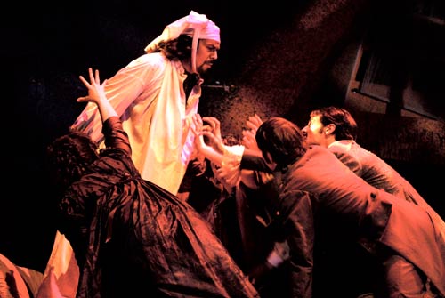 Gianni Schicchi (Jonathan Stinson) beseiged by enraged relatives of the deceased Donati after Schicchi tricked them in a scheme to posthumously re-write Donati's will